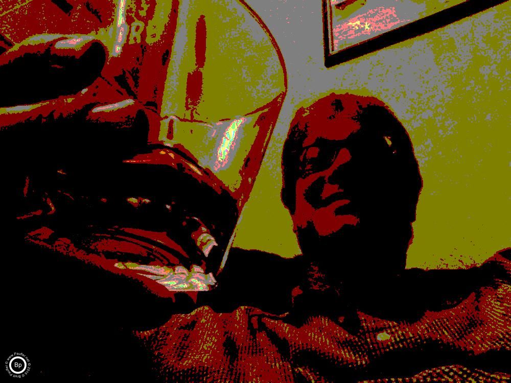 Leaning back, drinking whiskey, all of these images have been de-colorized, the bit numer of colors reduces, I call it posterizing, anyway, blurs it out, gives everything in this image a reddish-yellow hue, just like whiskey, it's a good image