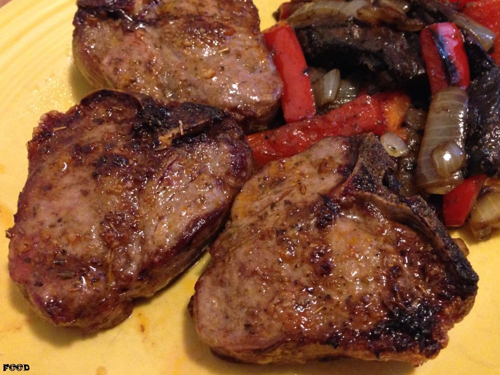Three nicely seared lamb chops with a mushroom and red pepper ratatouille on the ever popular yellow kitchen plate
