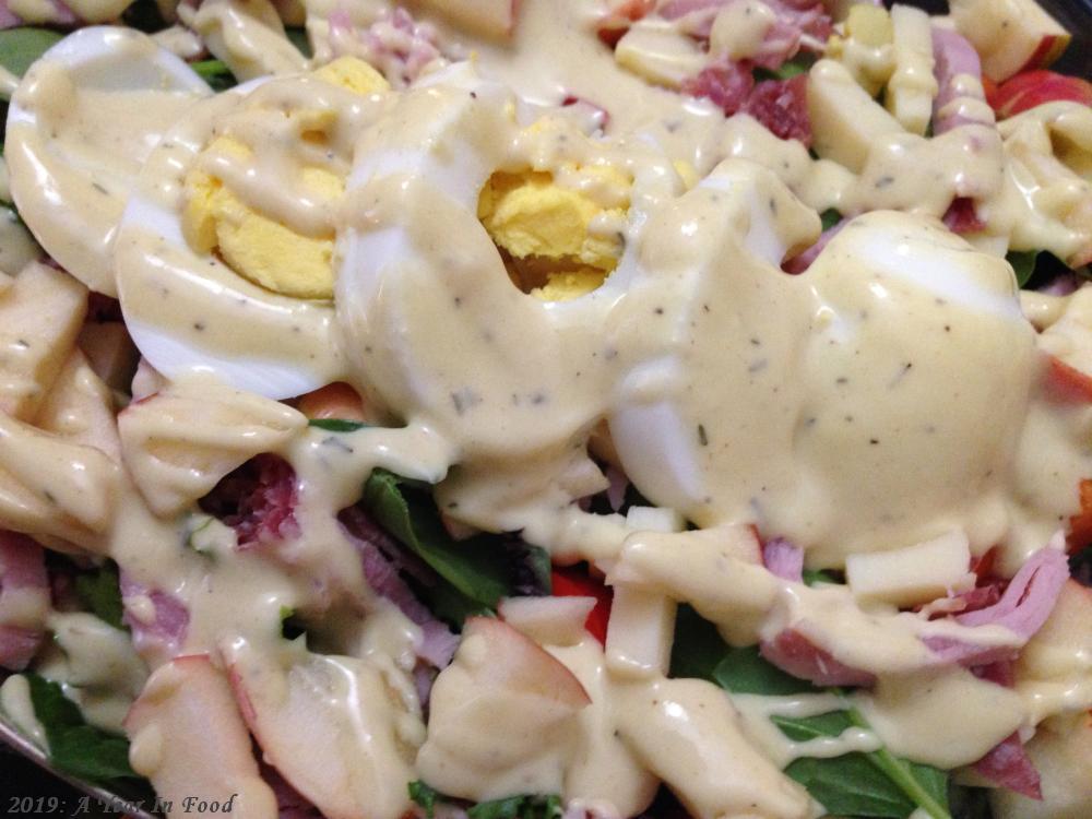 A Chefs Salad, with homemade creamy honey mustard vianagrette, eggs, greens, deli meat, that sort of stuff