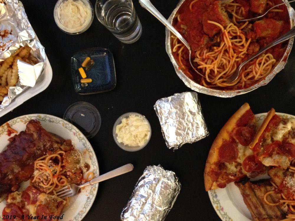 all from the same takeout place, pizza meatlovers, spaghetti with sausage and meatballs, ribs, bread, coleslaw, pills
