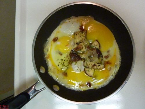 See previous image alt, the lot frying up in a pay, eggs, mushroom, sun dried tomatoes, pretty sure the cheese is still waiting to the side, though