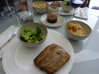 Ribs Jelly and Balsalmic vinegar, got a bunch of ribs on sale, obviously, to me anyhow, potato chips in bowls, broccoli too, table set for two