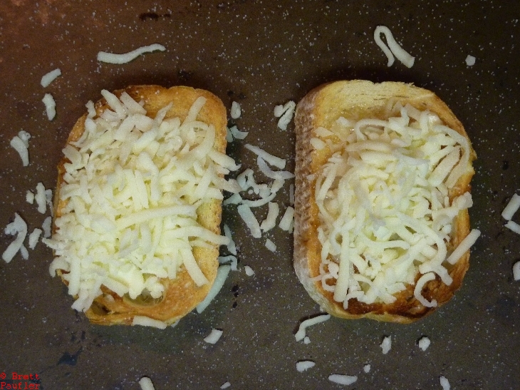 Cheese on Bread, click the image, cheese is cooked to a golden brown, wait, I should check that, yep, that is what happens, lots of cheese, nice and goey, i would have prefered darker taosting of cheese in center