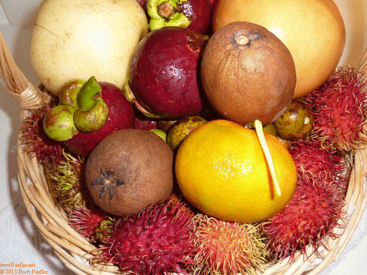 A Fruit Basket of Tropical Fruit: Mangostene, Pears, Tangerine, Logan, Rombutans