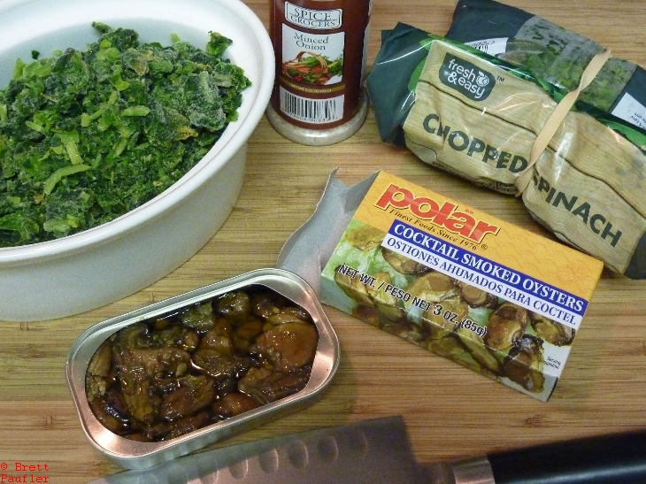 ingredients, spinach, smoked oysters, i would say the image is self explanatory, but that might defeat the concept