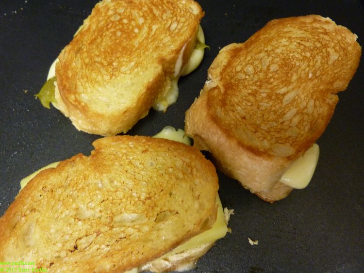 grilled cheese sandwich with ham, I believe, looks good, toasted just right, the trick is lots of butter and salt