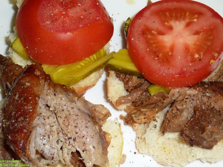 pulled pork sandwiches with pickles and tomatoes, I like my sandwiches wet