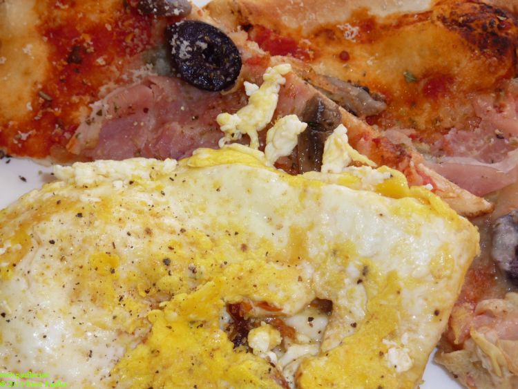pizza and eggs, liked the idea of left over pizza warmed in a pan and topped with eggs, liked the idea better than it was