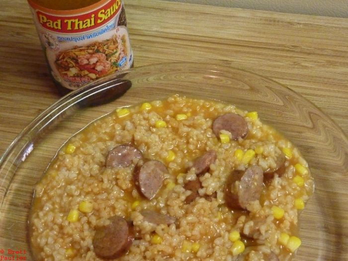 Essentiall rice, sausage, corn, and sauce, pad thai sauce