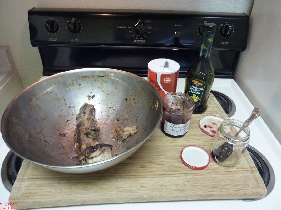 One Rib in bowl, sauce ingredients to the side, balsamic, salt, jelly