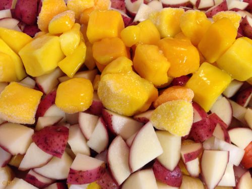 Braised Chicken Mango prior to going into oven, frozen mango chunks over diced potatoe