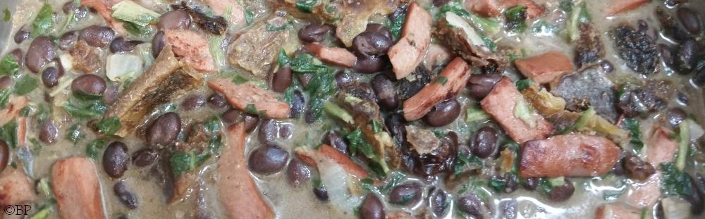 more of a stew than a soup, we have bot a beige light broth courtesy of the cream cheese from the creamed spinach, with bits of browned hot dog and black beans making the majority of the rest of the color