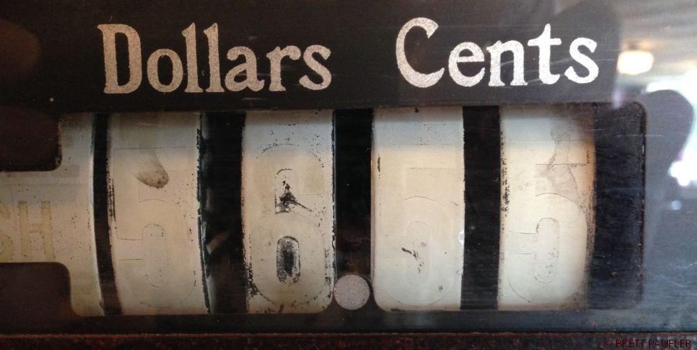 Close Up of an Old Cash Register Dials Dollars and Cents