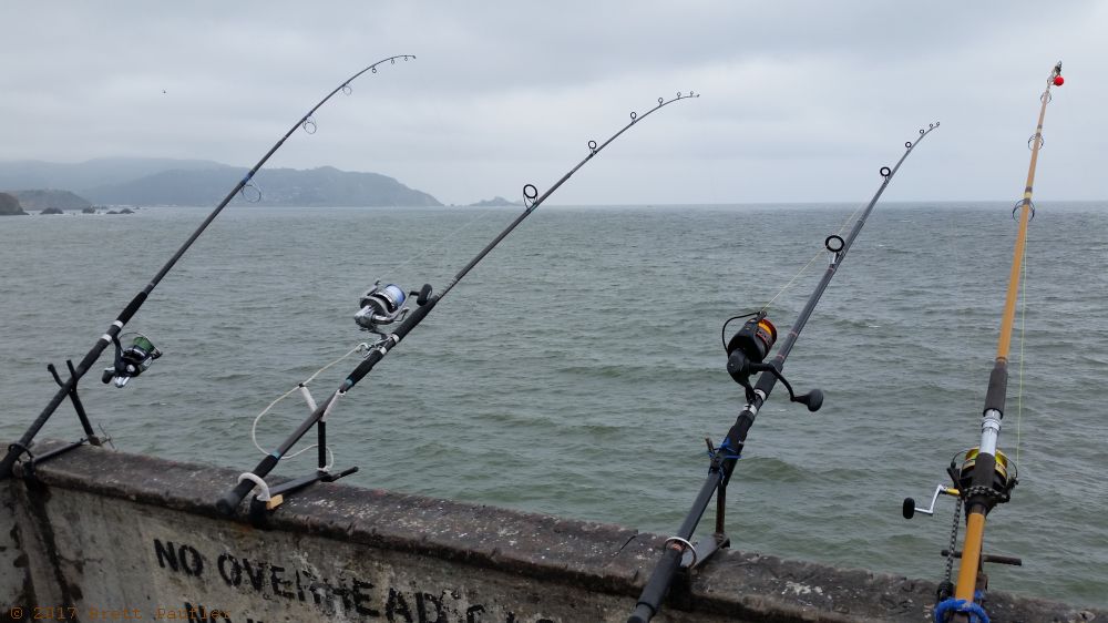 Actually, I do not know the limit, nor do I care, there were so many fishermen, that even at one pole, there were enough, though my guess is two poles is the law, here we have four poles sitting on a concrete pier, fishing for, who knows, its a nicely framed shot, very overcast day