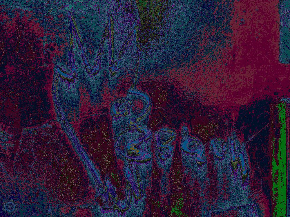 all images use effects from my butterfly stripe library, which utilizes a more or less random color shift, and from the several dozen selections for each image, I chose a few, the first few images are of graffiti, this one is of a face and some word I find hard to read