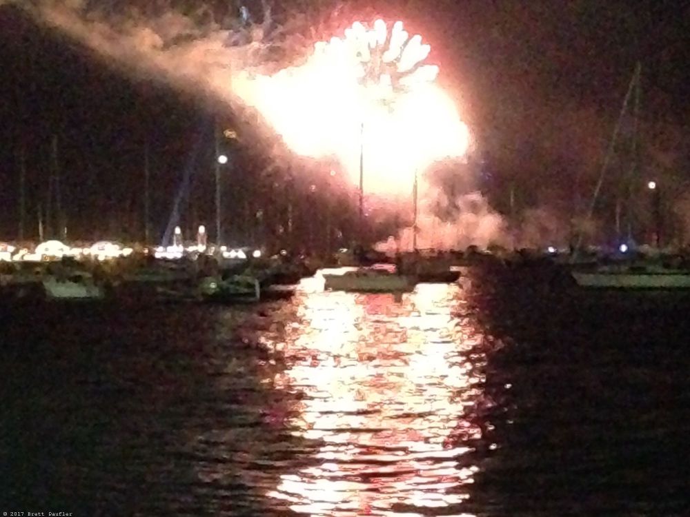 These next three shots are time oriented, more or less in the same spot, yeah, I think it is the same spot, some boats in the marina, tied, front row seat for the works, with the fireworks going off in the distance behind