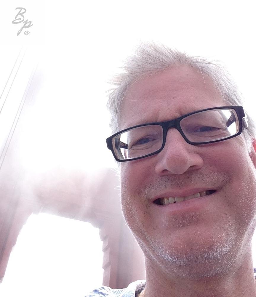 A Self Portrait on the Golden Gate Bridge, there is a fair bit of fog, so the pillars are hardly noticable, and I think I look a bit goofy, well, goofy may not be the right word, there was plenty of wind, and my mind was elsewhere and the smile seems a bit fake, if you know what I mean