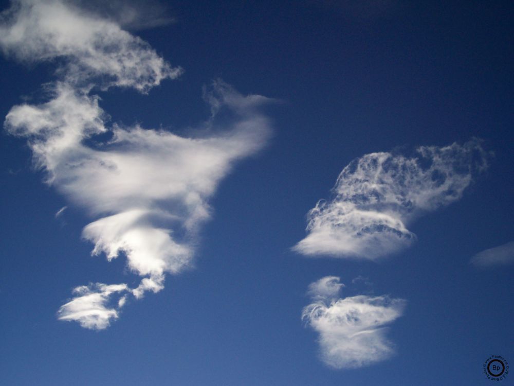 a simple image of the sky, clouds at is were, I like this one in particular because the grouping on the left, sort of reminds me of the Americas, yeah, I know, really groping there, but there it is, nonetheless, and so the total of it looks sort of map-like to me