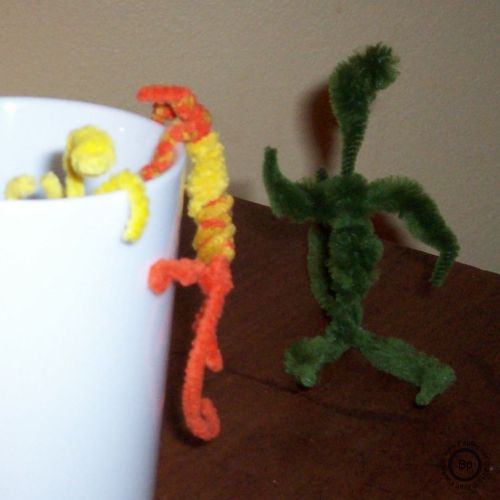 LeeZards playing in and about a cup, waiting for their morning fix, but by the speed with which they are moving, perhaps they have already had some