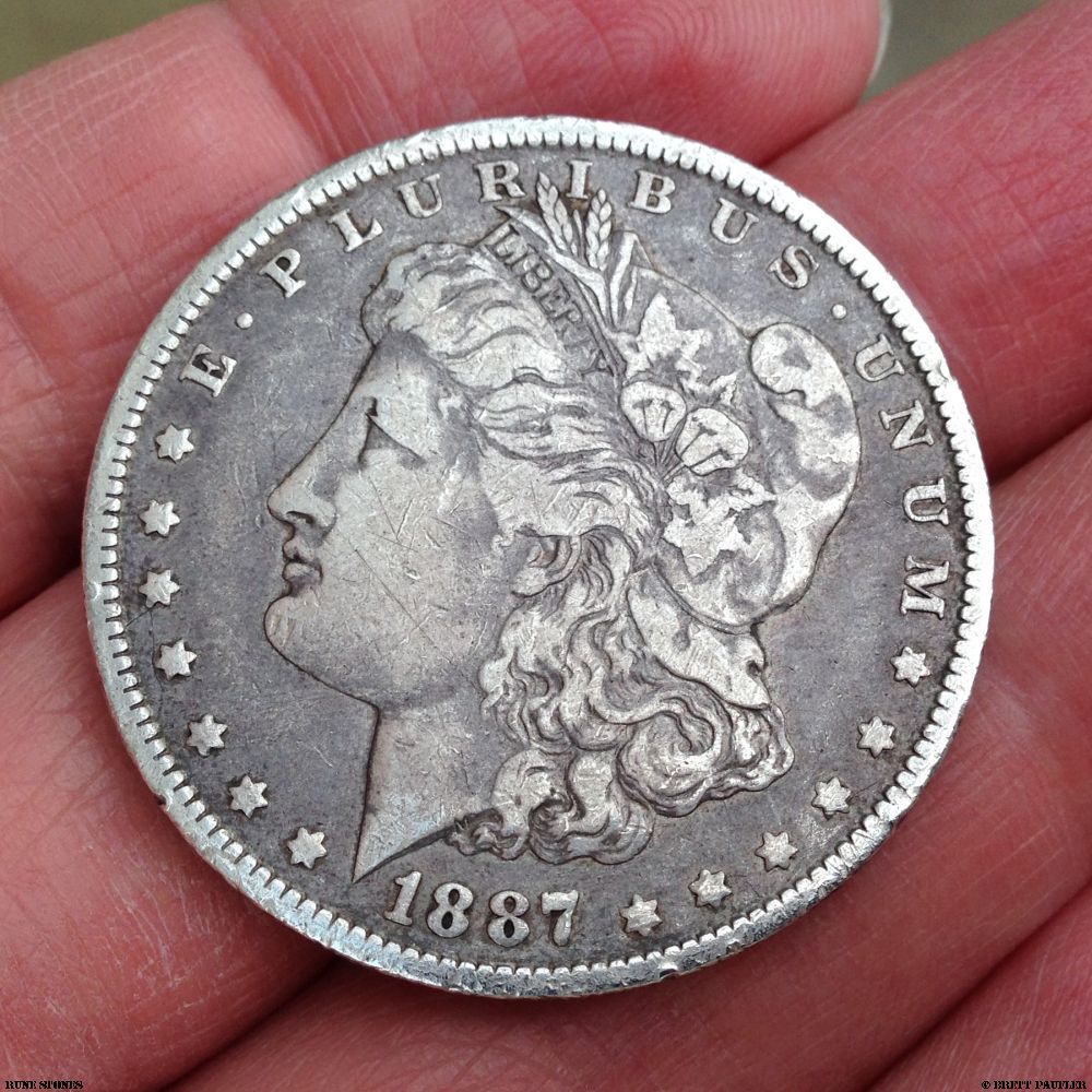 in my hand lies a Morgan Dollar, 1887, o Orleans mint, it was graded F12 when I bought it, I forget how much I paid, something in the twenty to twenty-five dollar range