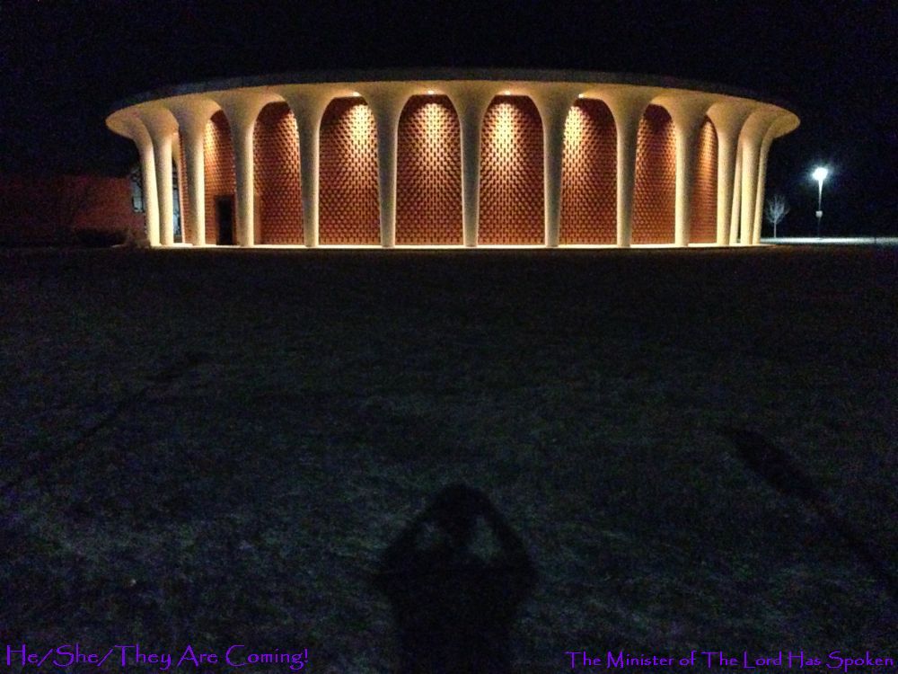 The Good Word A church, if I recall, Catholic, though, it looks more like a UFO to me, photo taken at night, I like how the grass has changed color... and I wonder if I should alter the background of the page, make it darker