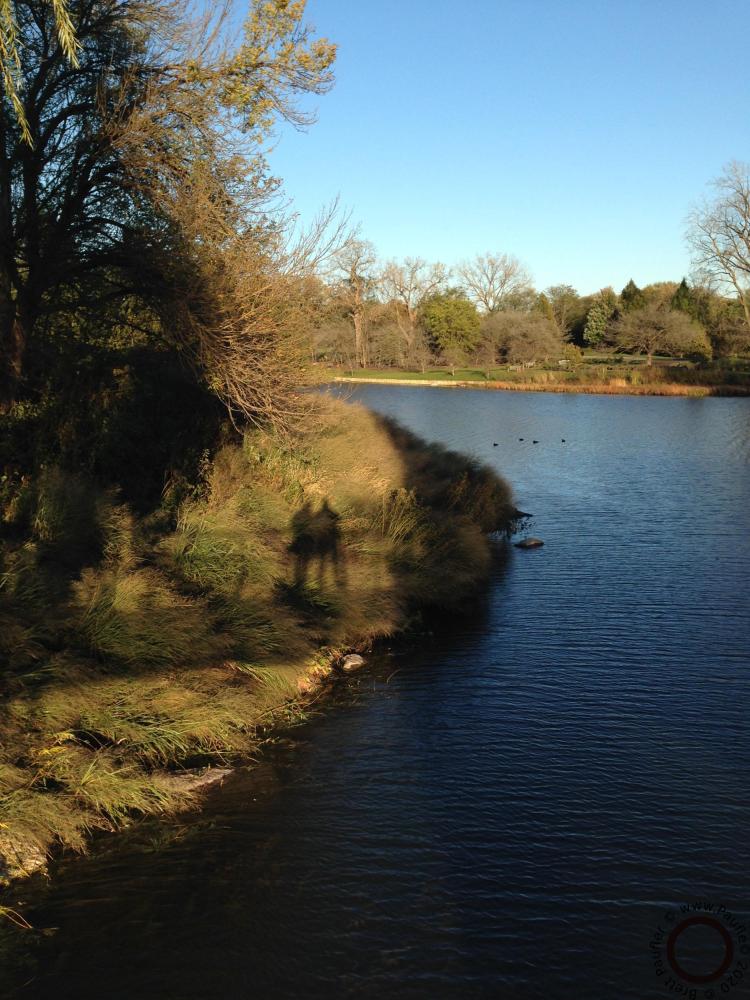 A nice view of the lake, one of the lakes, the highlight being a shadow, with two figures in bottom left center, it sort of stands out for me