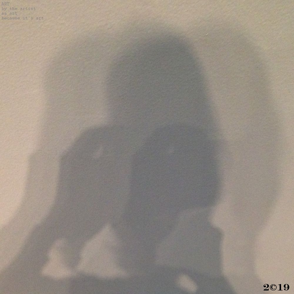 A photograph of the writer, or photographer, if you will, taken in shadow, with double exposure shadow surrounds, like a halo of sorts