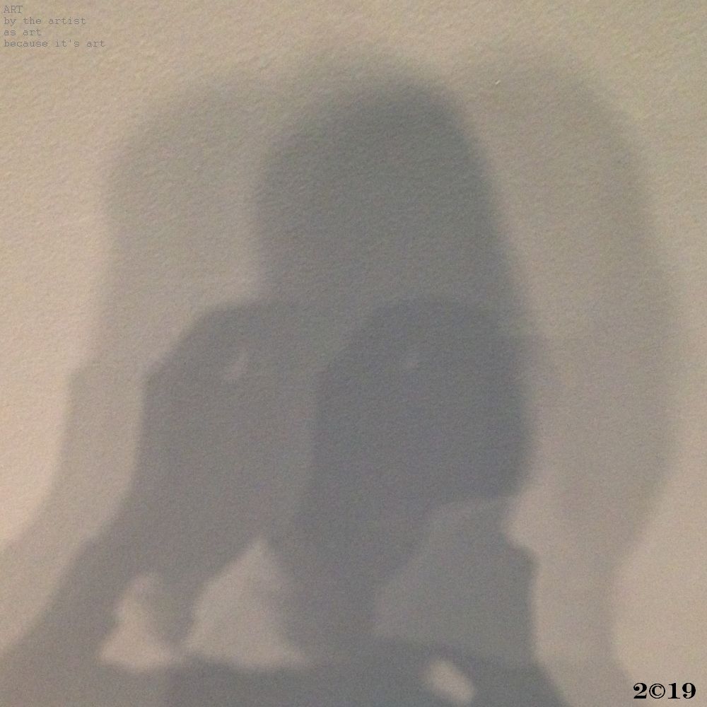 A photograph of the writer, or photographer, if you will, taken in shadow, with double exposure shadow surrounds, like a halo of sorts