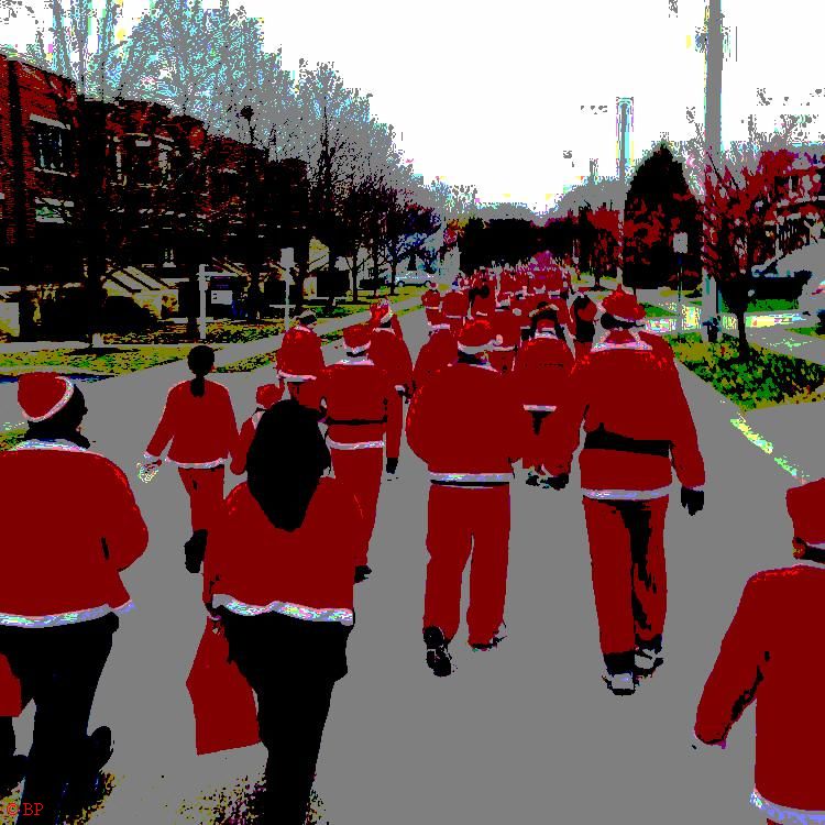 a bunch of santas walking down a suburban street, will they stop by your house, probably not, they are on a mission