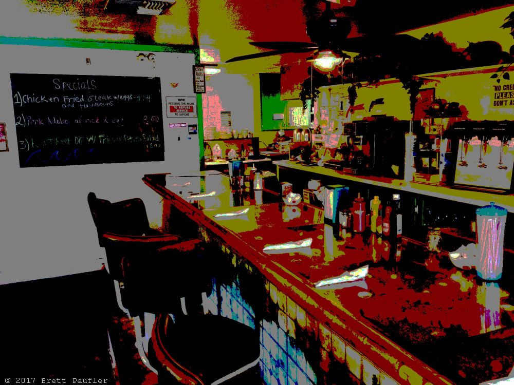 On the Delta, if I remember, so a good days drive from the previous, still, a nice little throw back, its a diner, view inside, the counter turned red from age, or maybe thats a filter, doing its thing, moving away from reality, as it does