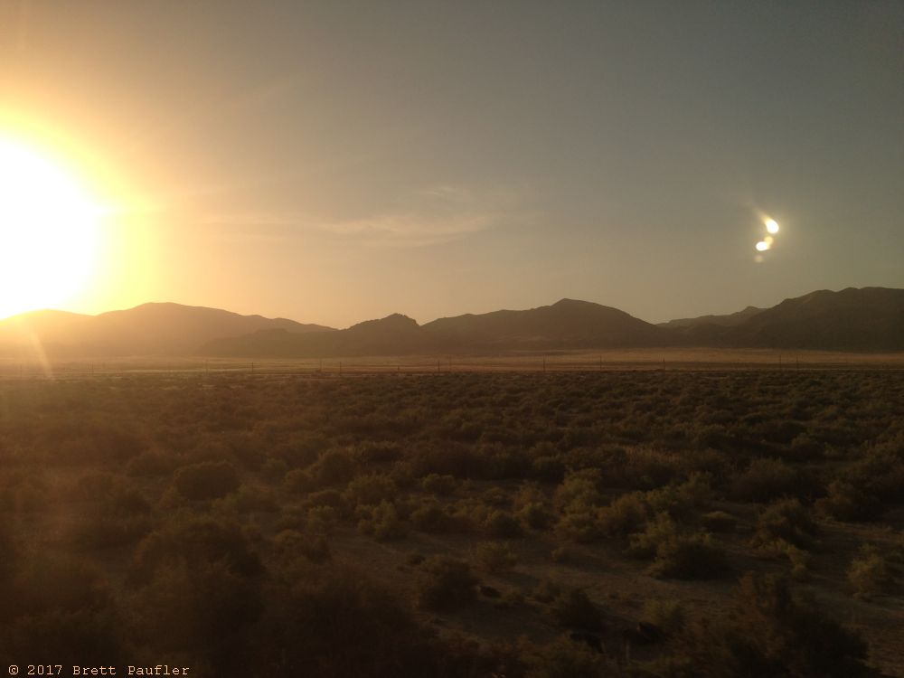 This would be a pair of those early morning UFOs that one so often sees in the desert, likely, I am sure I would be told, to be caused by the lens of my camera interacting with the polarized windows on the train, but why does the train need polarized windows, does the train even have polarized windows, you know what, I just going to assume this had nothing to do with polarized windows