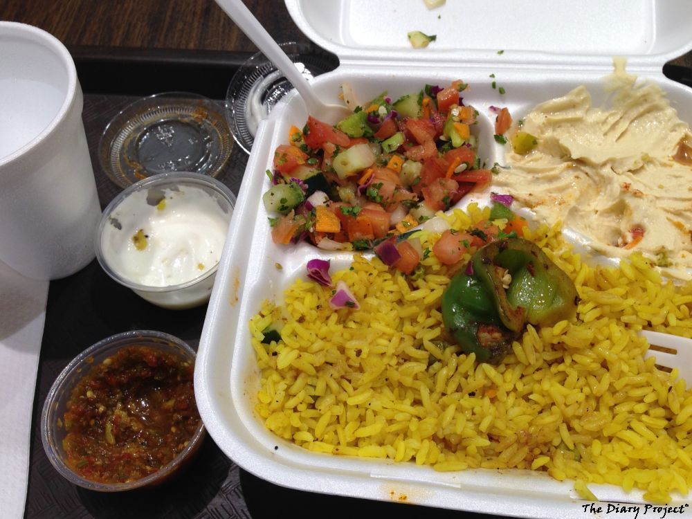 here is the same dish after the meat is gone, lots of rice, tomato salad, and, um, I keep on forgetting what that garbonzo bean salad is called... I still have the pita in the freezer, it was a plentiful helping