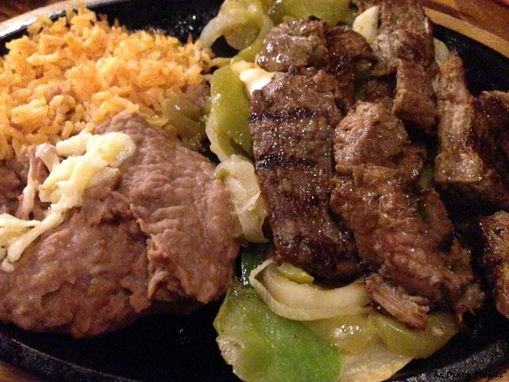 A standard fajita plate, it was all well and good, but it was the hand fried or fired tortillas that made the meal, this is just a plate of fried meat, onions,peppers, rice, beans, sprinkle of cheese, a standard sort of thing
