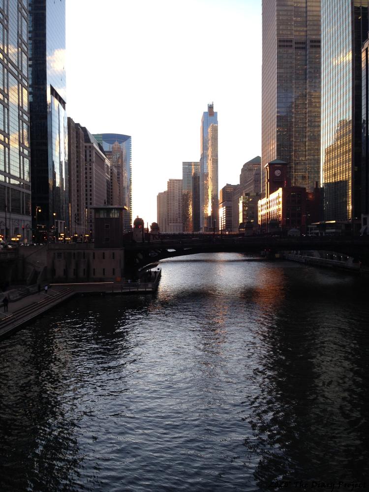 Taken from State St Bridge or so, just a few weeks ago, looking west towards the junction, up the river, the sun is setting, but the real trick is the reflected light off the buildings, which cause streaks on the water below