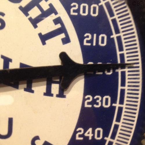 The Pointer on an Industrial Weight Scale, it indicates a weight of slightly under 220lbs