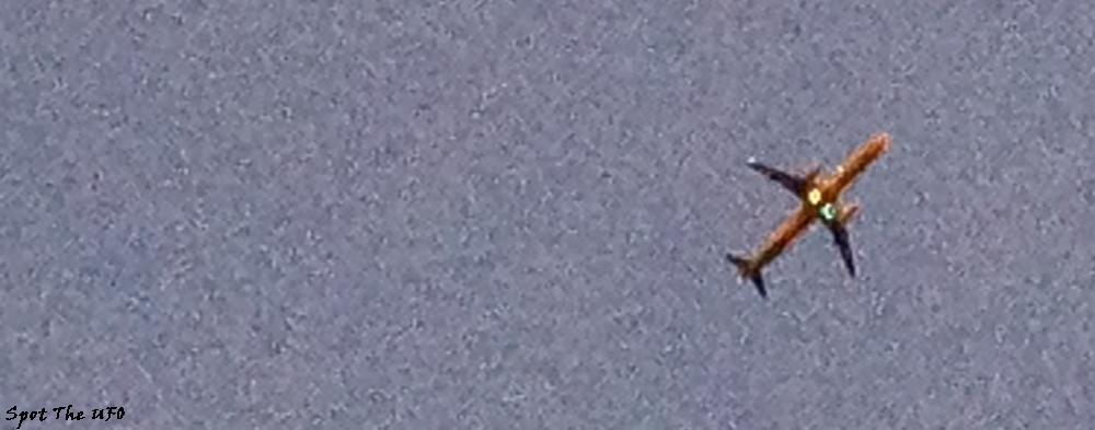Spot The UFO, it is a picture of the sky with a plane, the background is wavy and distorted and highly reminiscent (though, a bit of an exaggeration) of how I view the sky these days through my naked eyes, wavy little distortions