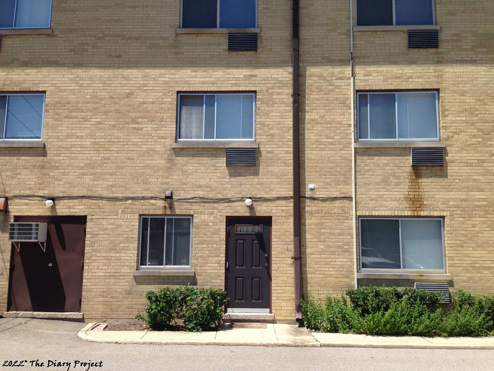 Yellow Brick Apartment Facade with attached mechanical room