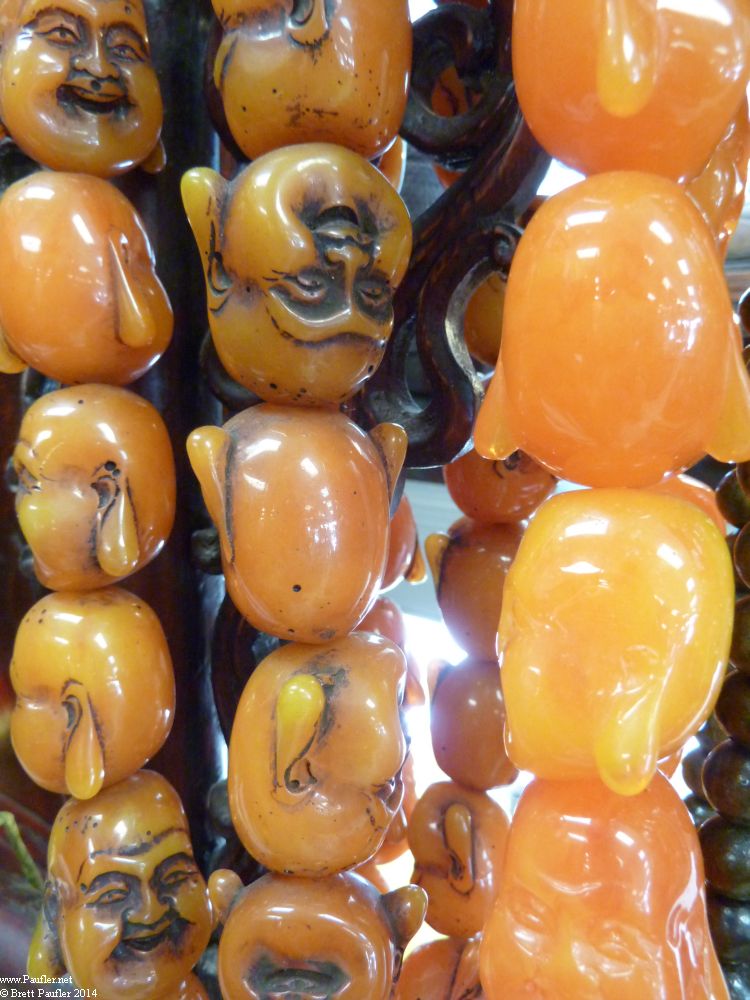 ChinaTown - Shop Tinkets - Buddha on Necklace - Fake Amber