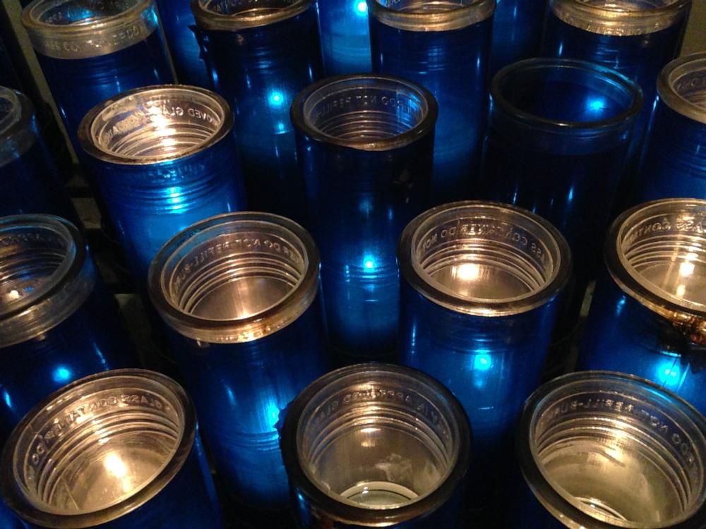 Close Up of Blue Memorial Candle Holders from a Catholic Church