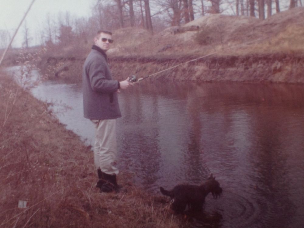 here he is fishing again, same dog, same river, slightly different place, I am going to guess its in Buffalo New York