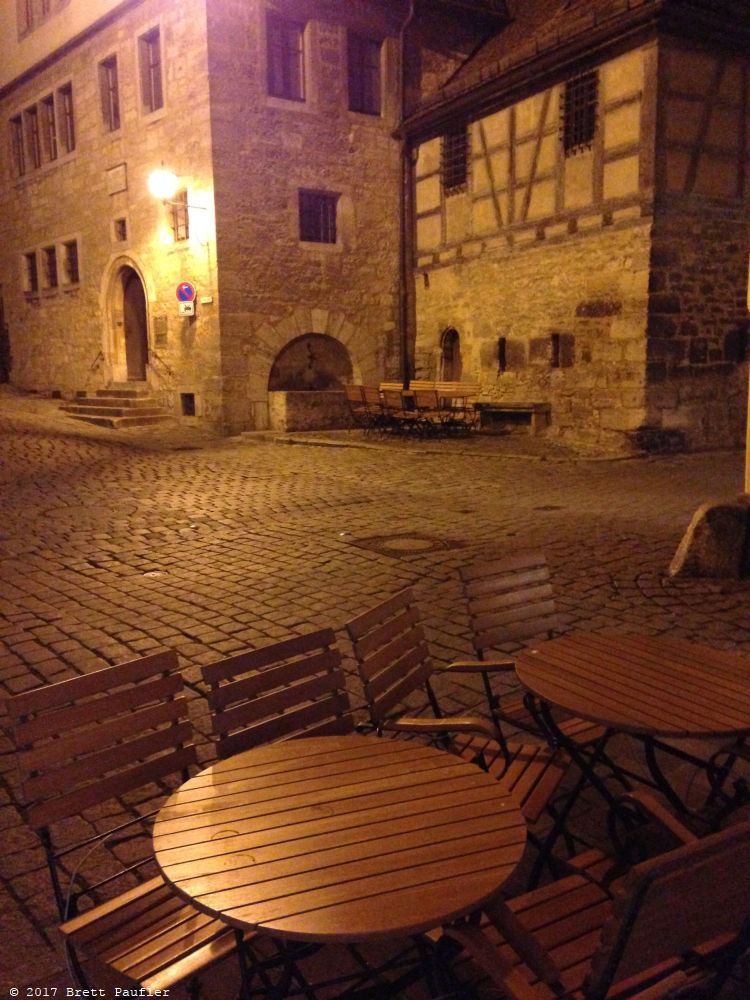 Castle town at night with the cafe chairs still out, In the states these would have been chained up, I am almost surprised no one took it upon themselves to sit down and have a smoke, perhaps by someone, I mean me