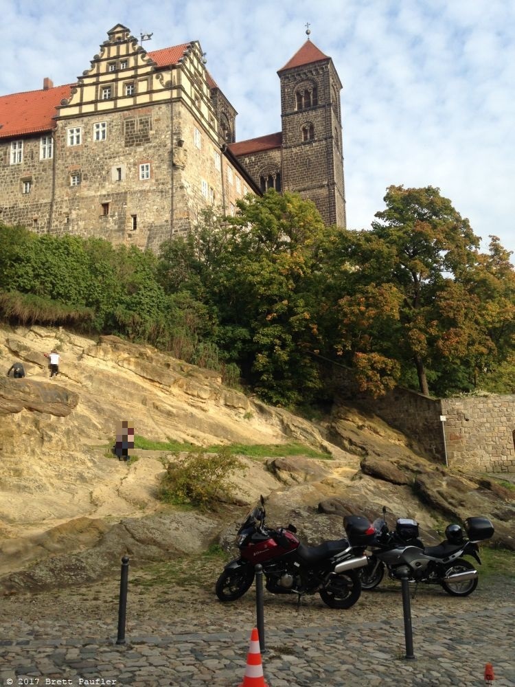 Castle with motorcycles parked at the base, a nice big castle