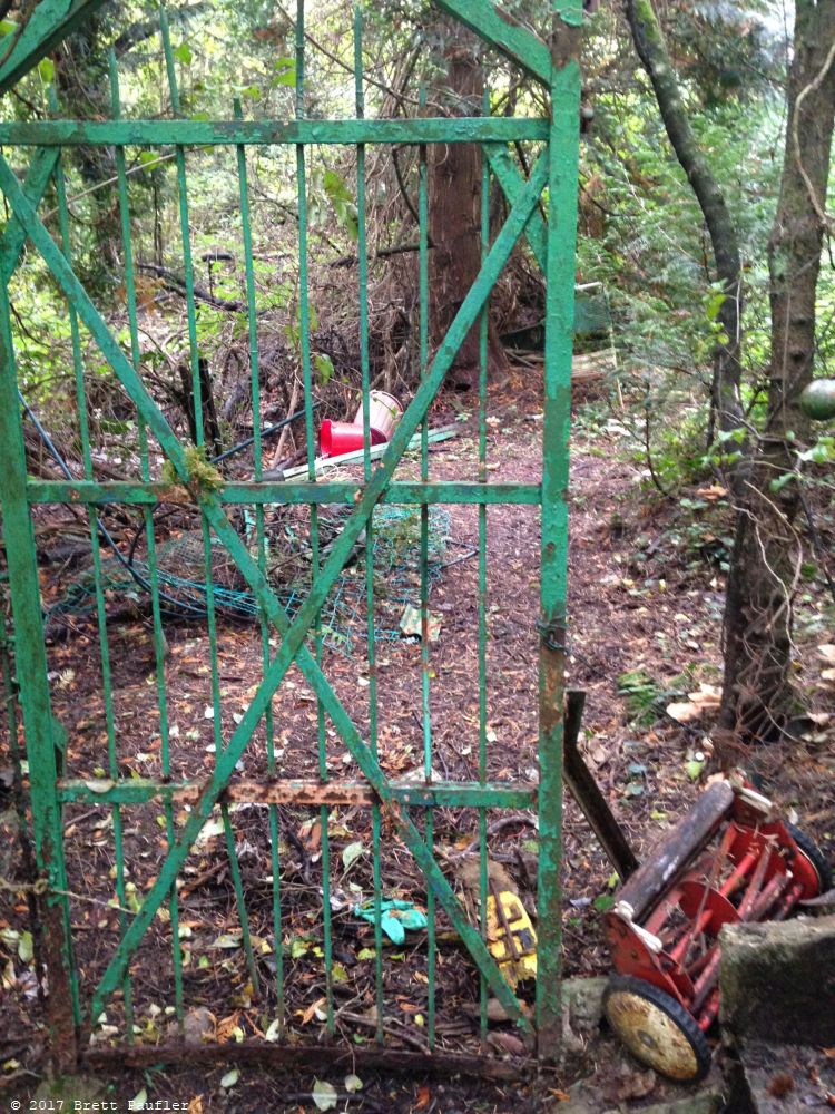 Walking down the back path from a castle, same one wiht the shaka suit of armor later, we came across this gate, I believe it led to someones backyard, so this was a storage area for their garden, it lookde sort of run down, million dollar castle, German Trash cottage