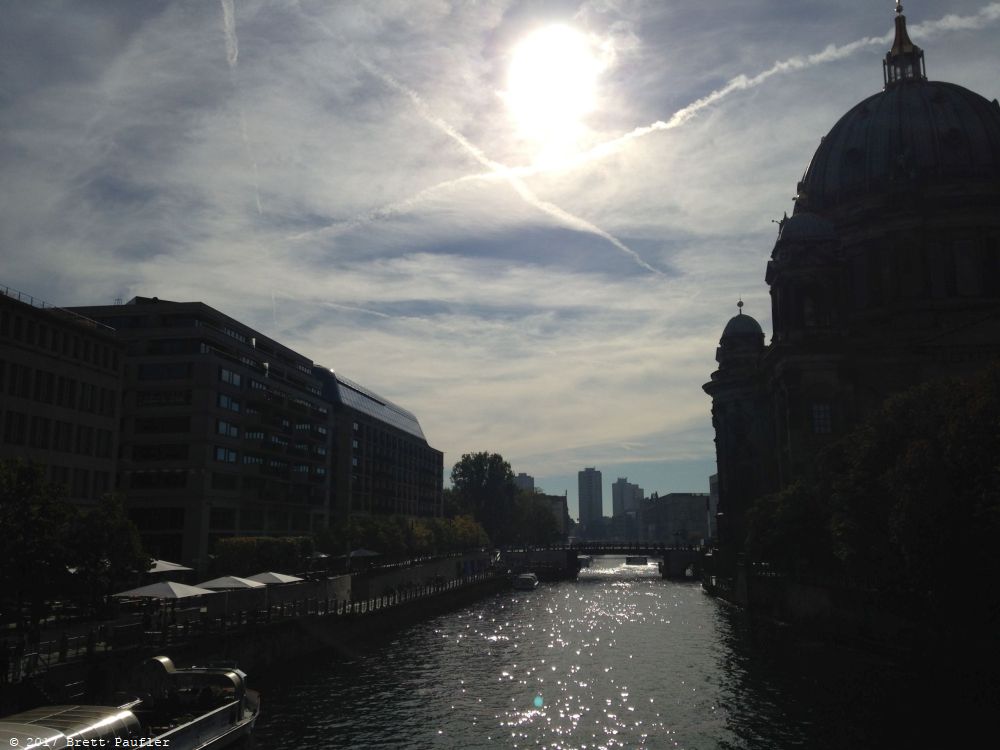 Berlin River, by the Berlin Dome, actually, I think that is the Dome of Berlin, we climbed to the top of that which was well worth it, here the sun glares in an overcast sky, river and buildings in glittering shadow