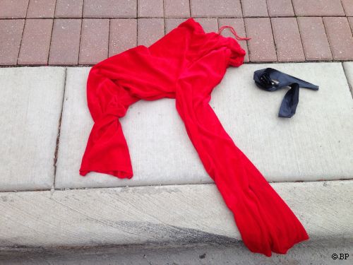 a pair of santa pants, which slipped over whatever else one was wearing, or which many cut off and used like shorts, lying by curb
