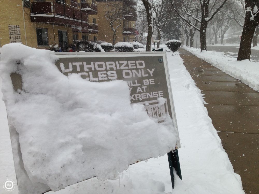 A sign covered in snow
