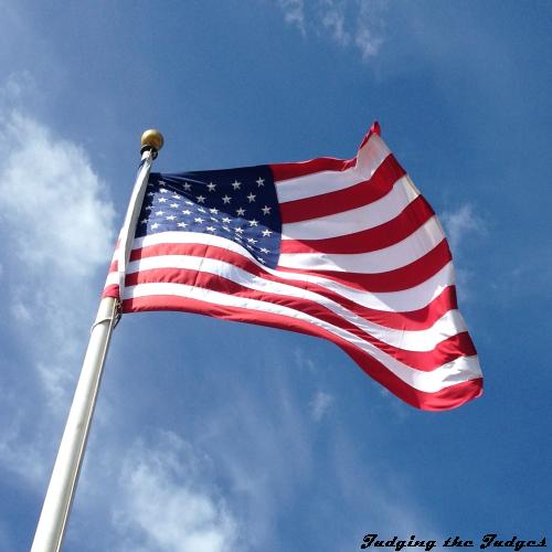 A United States of America flag fluttering in the wind, three time series images