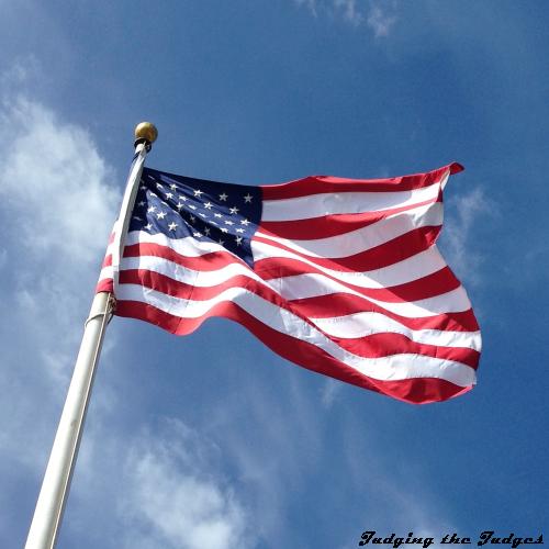 A United States of America flag fluttering in the wind, three time series images