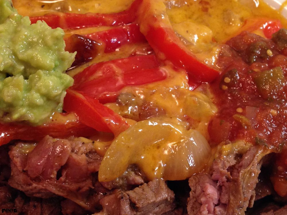 Ah, this was good, some high quality steak smothered in salsa, sour cream, guacamole, peppers, melted cheese, and all the rest, very delightful, what every meal should be, that glistening cheese is where it is at