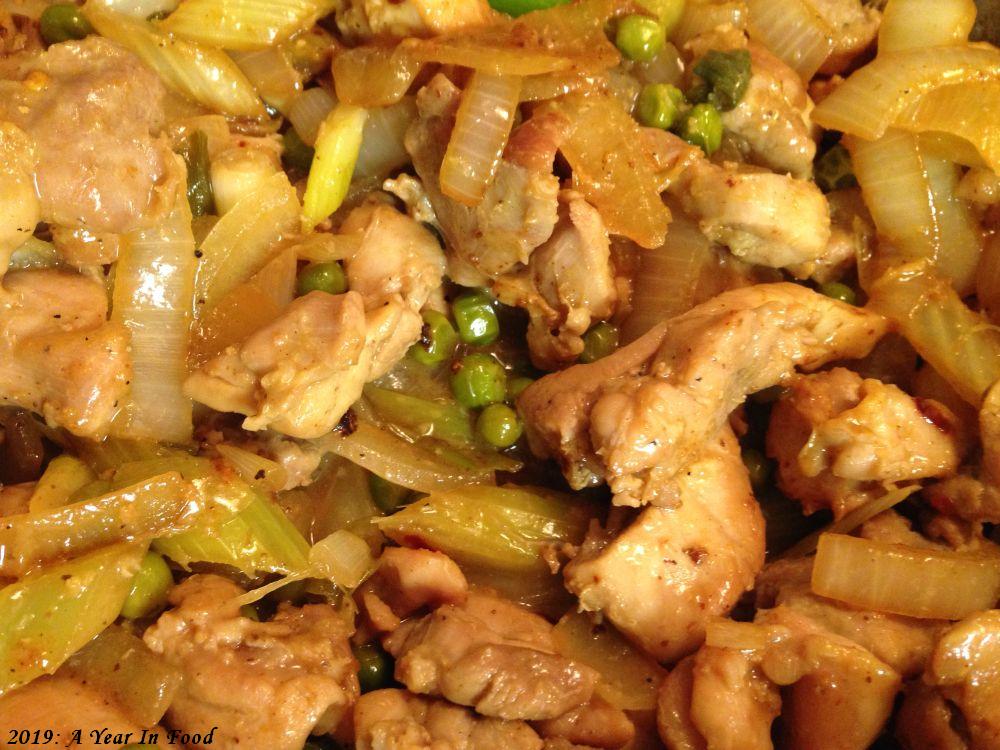 Ginger Chicken, which consists of chicken soy sauce, a bit of heat, probably fish sauce, ginger no doubt, chicken, onions, probably some peas, it was good